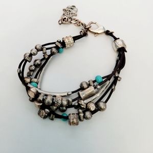 Handmade bracelet, leather with metal peices. Purchased overseas.